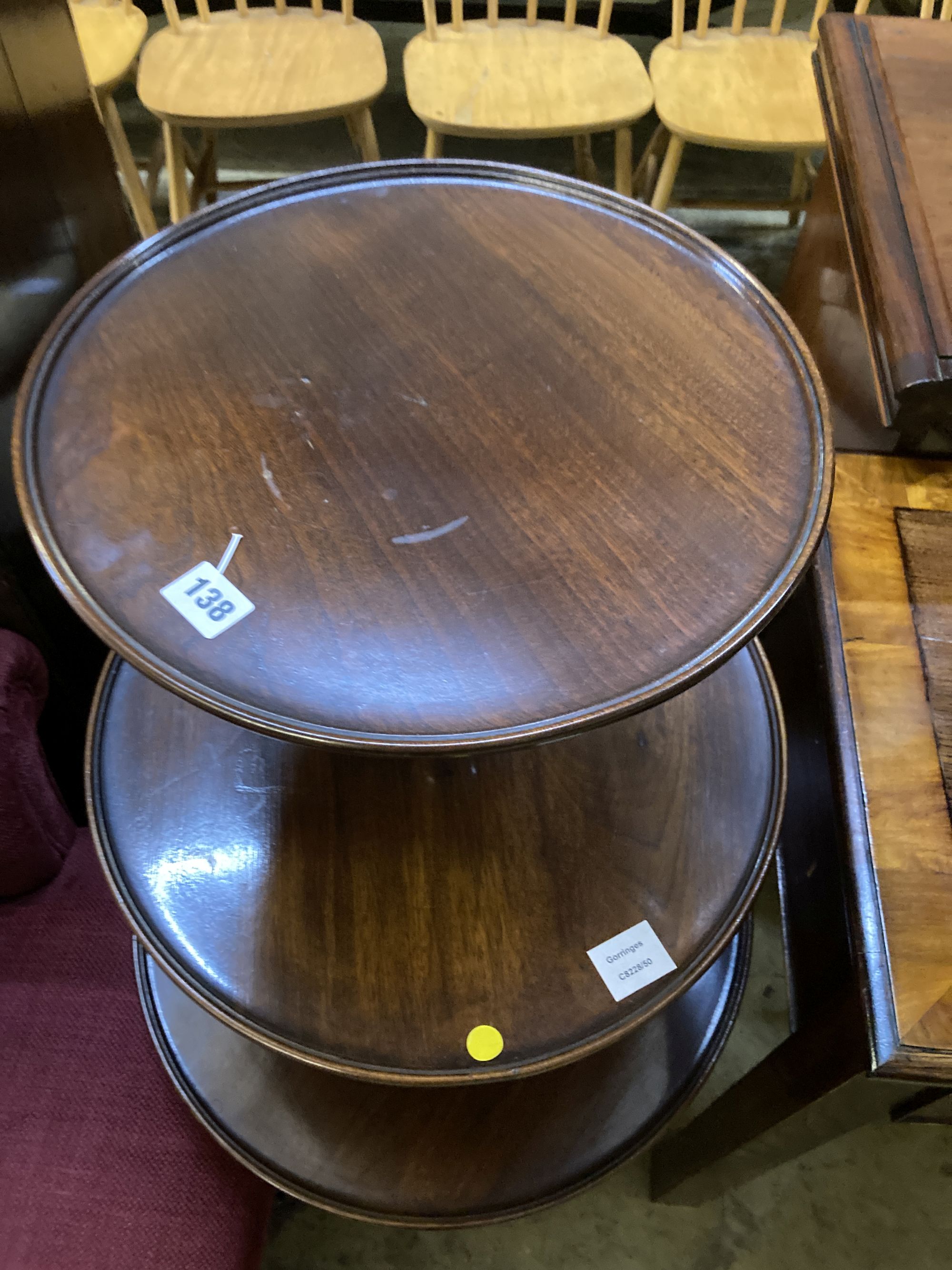 A George III and later mahogany three tier dumb waiter, 54cm diameter, height 108cm